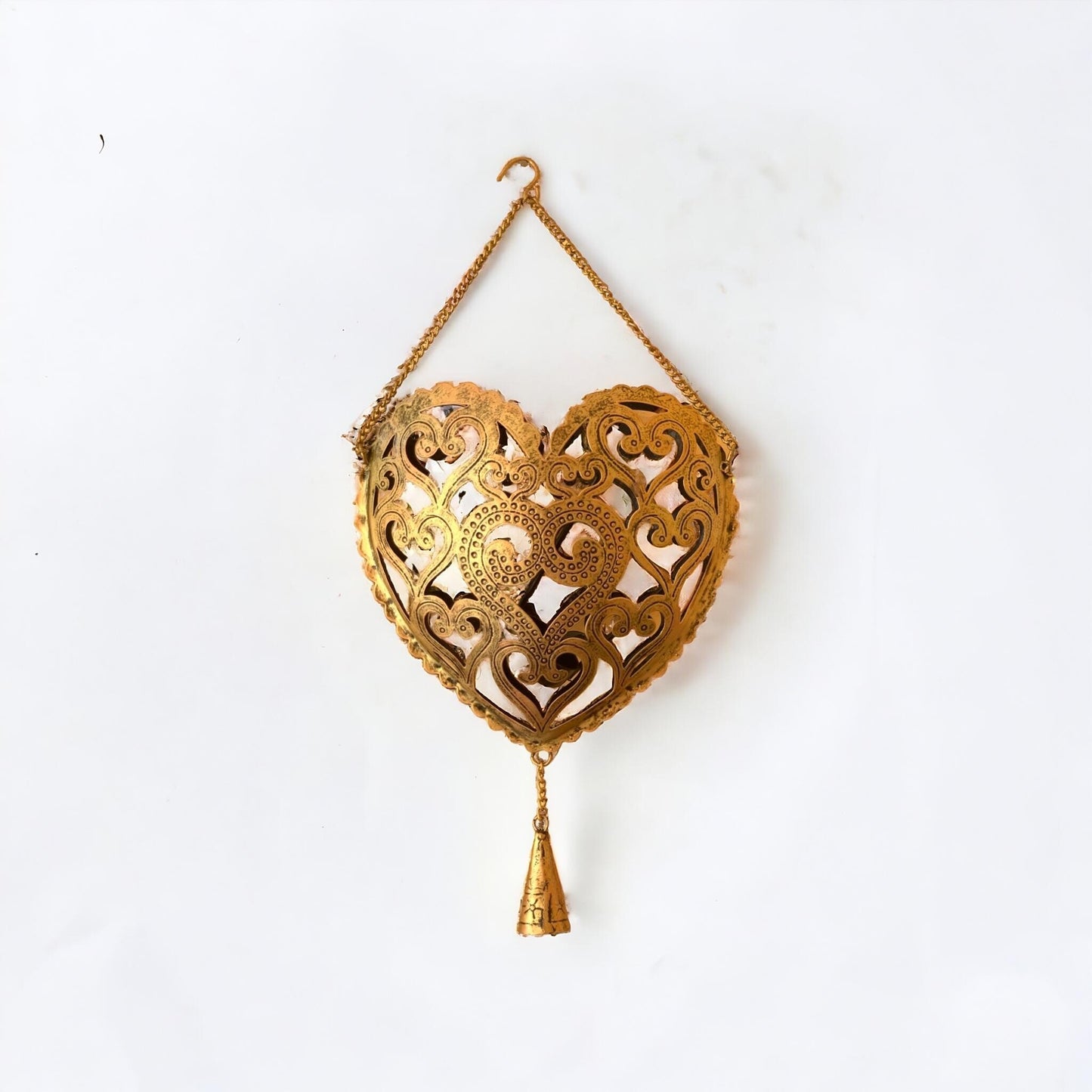 Decorative gold heart-shaped hanging ornament on a white background