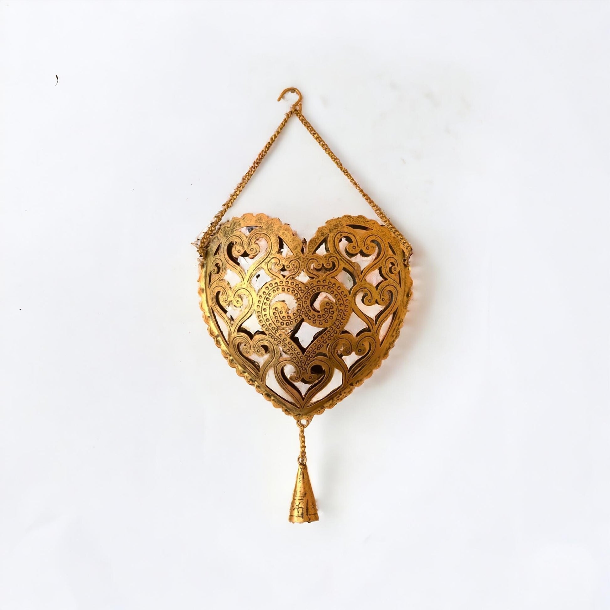 Decorative gold heart-shaped hanging ornament on a white background
