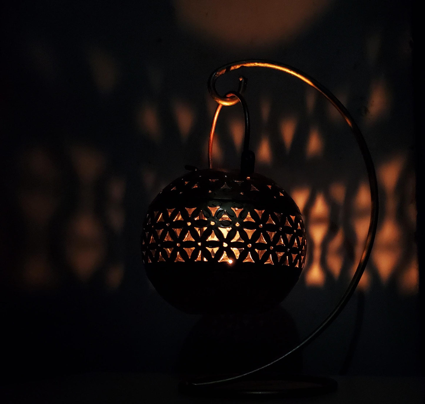 Decorative lantern with intricate design in the dark
