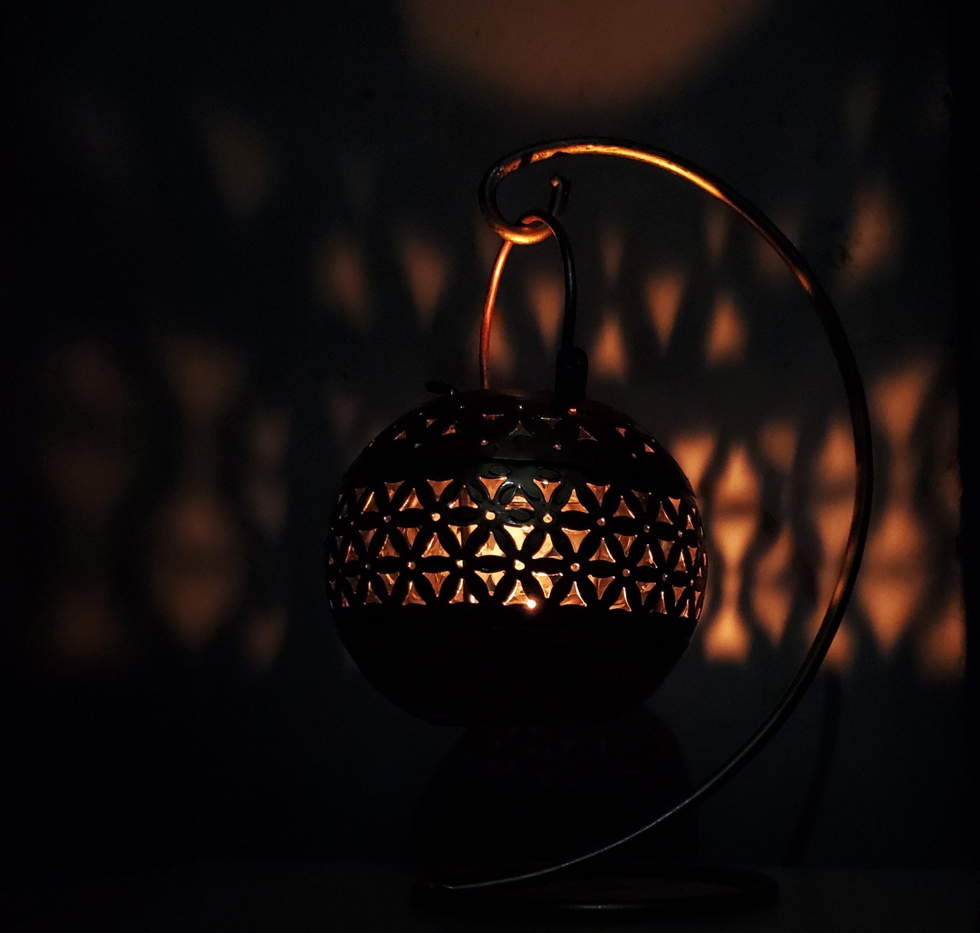 Decorative lantern with intricate design in the dark