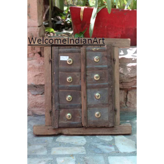 Wooden jewelry box with brass knobs on a stone surface, branded 'WelcomeIndianArt'.