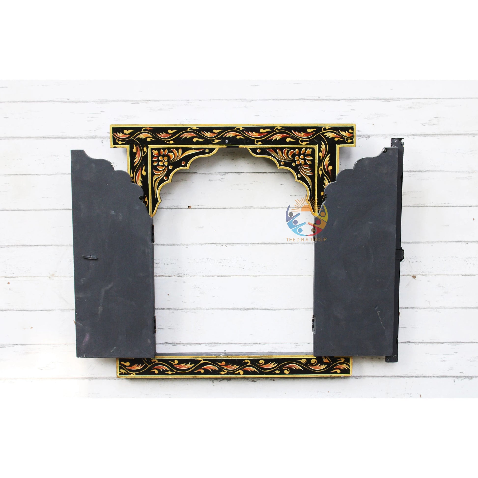 Decorative black and gold frame on a white wooden background