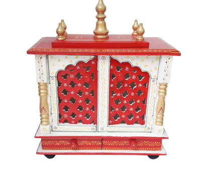 The INDIAN CRAFTS STORE Handmade Wooden Crafted Hindu Pooja Wooden is a decorative home mandir in red, white, and gold with ornate cut-out doors, golden pillars, two base drawers, and elegant golden finials.