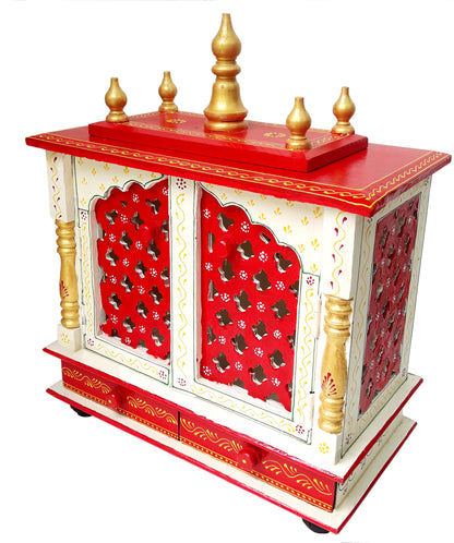 The INDIAN CRAFTS STORE Handmade Wooden Crafted Hindu Pooja Wooden temple features red and white wood, gold accents, lattice doors, ornate pillars, two base drawers, golden finials on top, and intricate painted floral patterns.