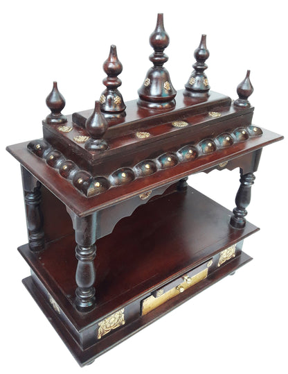 The Handcrafted Wooden Pooja Ghar Art Wooden by INDIAN CRAFTS STORE features ornate carved pillars, gold accents, dome finials, and two tiers—an elegant home temple ideal for displaying idols or gifting as a beautiful home décor piece.