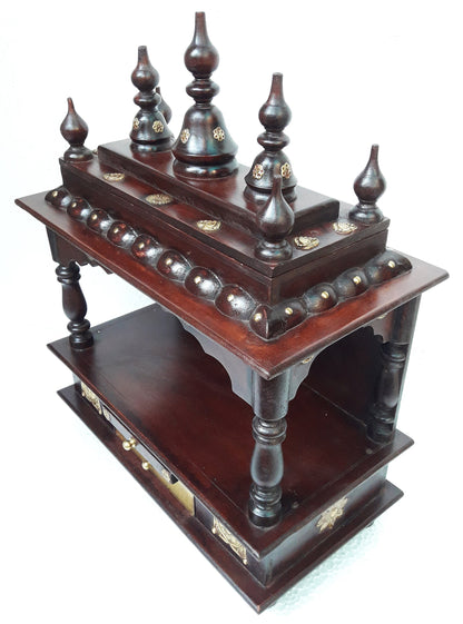 The INDIAN CRAFTS STORE Handcrafted Wooden Pooja Ghar Art Wooden features intricate carvings, elevated pillars, domed finials, and two shelves—ideal for home décor, gifting, or religious use.